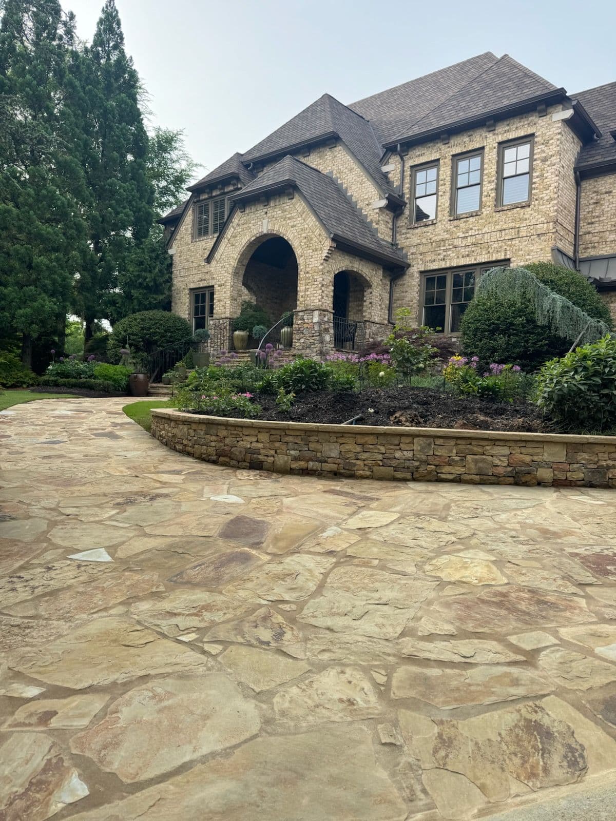 Elegant Flagstone Pathway and Seating Wall image